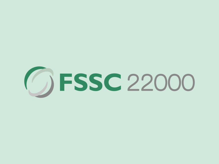 FSSC 22000 Logo auf hellgrünem Hintergrund, symbolisiert Lebensmittelsicherheitsstandard.